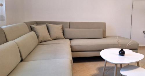 a living room with a couch and a table at Sunshine in Vlorë