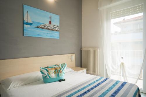 Posteľ alebo postele v izbe v ubytovaní Residence Rimini Mare