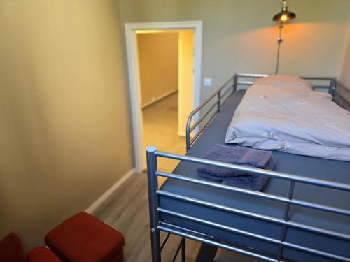 a bunk bed with towels on it in a room at Stora Ekeberg vandrarhem in Axvall