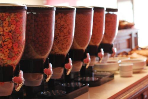 a row of vases filled with food on a counter at La Campiña Club Hotel & Spa in Santa Rosa