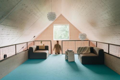 Posezení v ubytování Domesi Concept House Pulečný