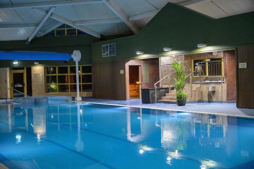 a large swimming pool in a hotel room at Newtown Park Hotel in Wexford