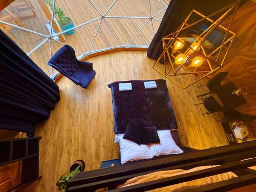 an overhead view of a room with a table and chairs at Glamping LA BELLA Suntago in Aleksandria