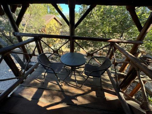 a table and chairs sitting on a porch at Thula-Thula Private Game Lodge Mabalingwe in Bela-Bela