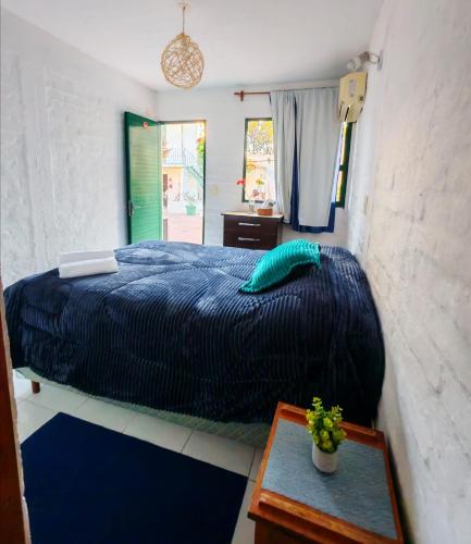 Ένα ή περισσότερα κρεβάτια σε δωμάτιο στο Hostel Colibri Colonia
