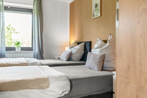 Katil atau katil-katil dalam bilik di Modern House "Brick Lane" with Terrace and Wintergarden - LOFTIGO