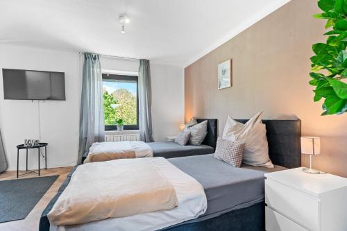 Katil atau katil-katil dalam bilik di Modern House "Brick Lane" with Terrace and Wintergarden - LOFTIGO
