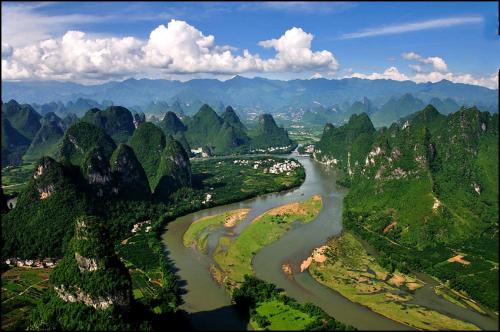 an aerial view of a river in the mountains at Li-river Island Resort Xingping Yangshuo in Yangshuo