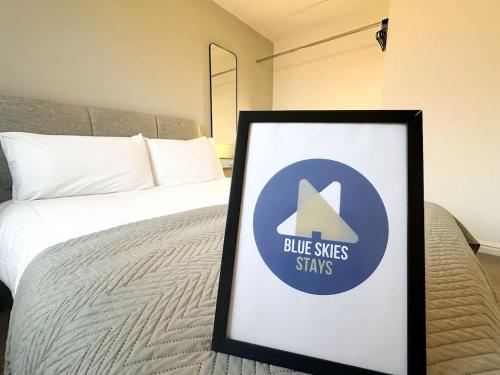 a picture of a bed with a sign on it at Beck House by Blue Skies Stays in Middlesbrough
