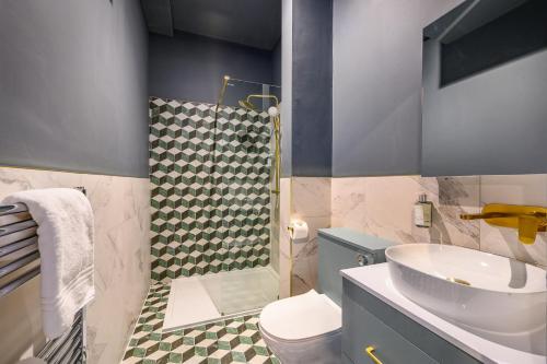 a bathroom with a sink and a toilet and a shower at Harrogate by Deuce Hotels in Harrogate