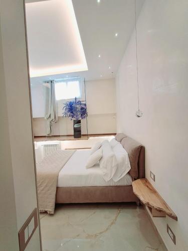 a bedroom with a bed with a large mirror at Frem lord in La Spezia