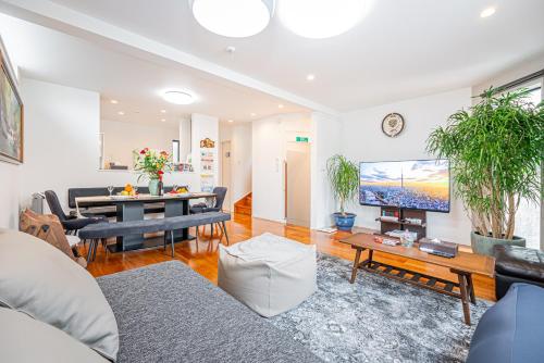 a living room with a couch and a table at Ikebukuro Shopping Street 3BR in Tokyo