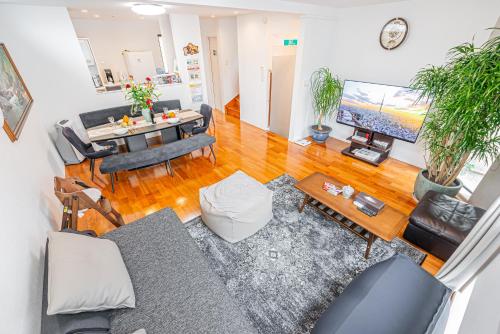 an overhead view of a living room with a couch and a table at Ikebukuro Shopping Street 3BR in Tokyo