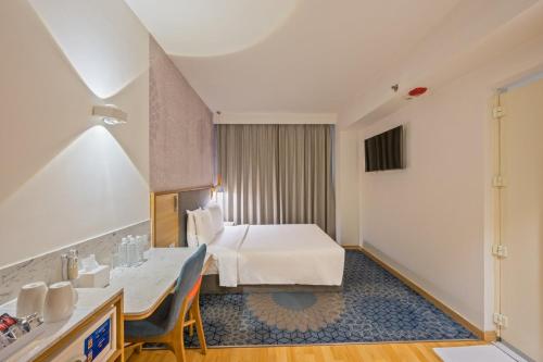 Postel nebo postele na pokoji v ubytování Holiday Inn Express Gurugram Sector 50 by IHG