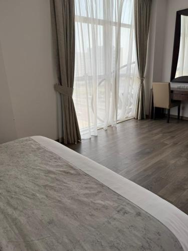 Postel nebo postele na pokoji v ubytování Helat Hotel