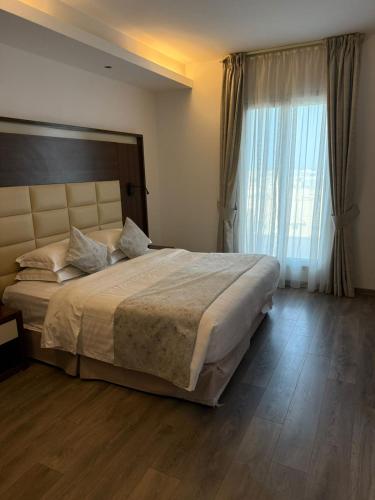 Postel nebo postele na pokoji v ubytování Helat Hotel