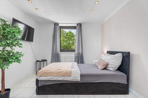 Katil atau katil-katil dalam bilik di Modern House "Brick Lane" with Terrace and Wintergarden - LOFTIGO