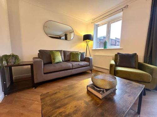 a living room with a couch and a table at Wharf House by Blue Skies Stays in Stockton-on-Tees