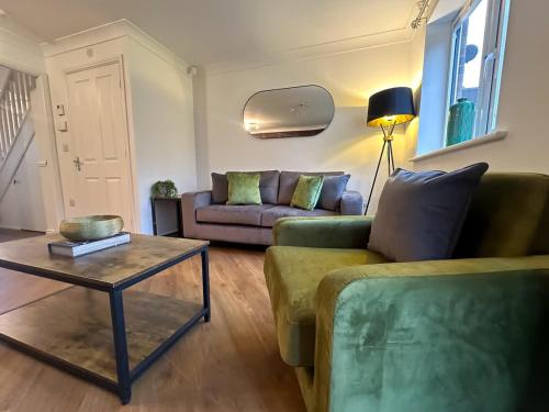 a living room with a couch and a table at Wharf House by Blue Skies Stays in Stockton-on-Tees