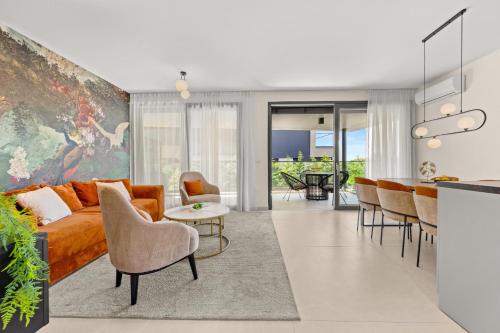 a living room with a couch and a table at Luxury Seaside Apartments Zadar in Zadar