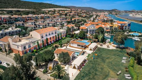 an aerial view of a town next to a body of water at Antmare Hotel in Alacati
