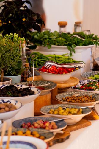 a buffet with many plates of food on a table at Antmare Hotel in Alacati