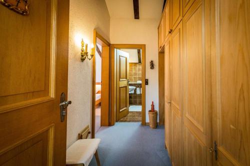 a hallway with a door leading to a room at Landhotel Sonnleiten in Bad Reichenhall