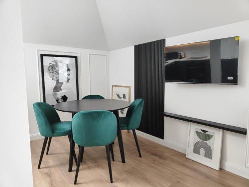 Μια τηλεόραση ή/και κέντρο ψυχαγωγίας στο Apartament Jak w banku II