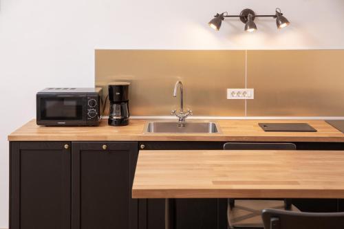 Una cocina o cocineta en Hirscher Apartments