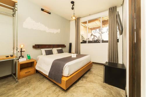 a hotel room with a bed and a window at OYO Casa Anzures Mexico City in Mexico City