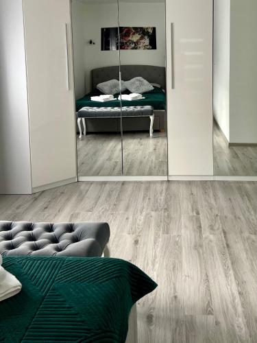 a room with a mirror and a bed in it at Zakątek u Ili in Rzepiska