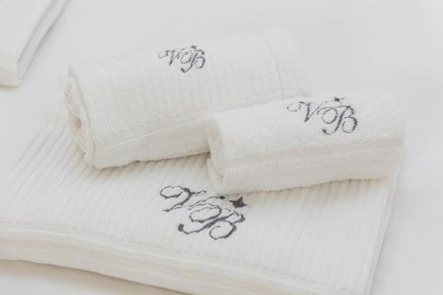 a group of towels with drawings on them at Vicolo Trevi Apartment by Rental in Rome in Rome