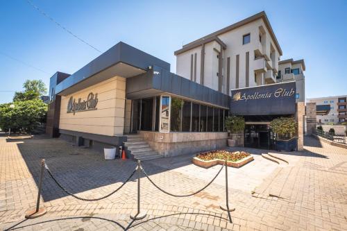 a building with a pizza court in front of it at Apollonia Hotel Gevgelija in Gevgelija