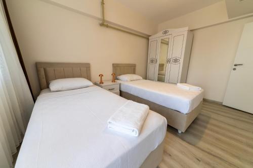 Katil atau katil-katil dalam bilik di Belya Apart Hotel