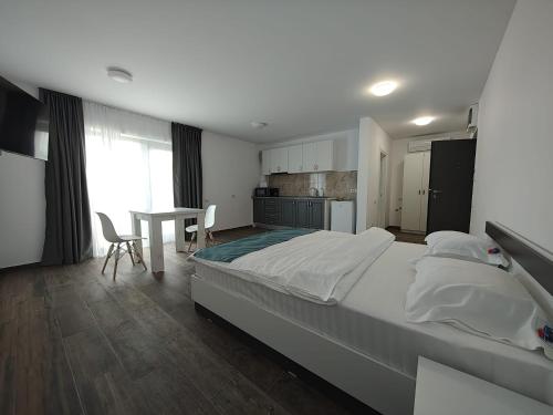 Ένα ή περισσότερα κρεβάτια σε δωμάτιο στο Complex Rezidential Vamaland