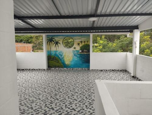 a room with a mural on the wall at Casa para vacaciones Neiva Rivera Huila in Rivera