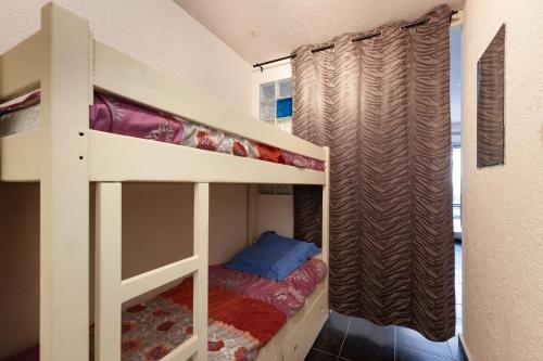 Ένα ή περισσότερα κρεβάτια σε δωμάτιο στο Chez Alain et Martine