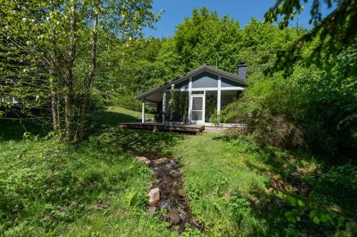 a small house in the middle of a field at 2 bis 4 Personen mit Infrarotsauna F2H9 in Ruhla