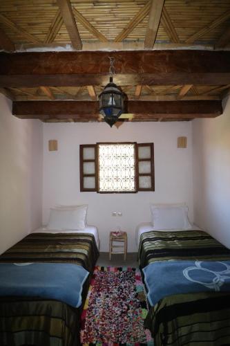 Ein Bett oder Betten in einem Zimmer der Unterkunft Gîte Imsker Elbour