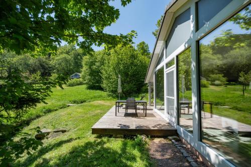 a porch of a house with a picnic table on it at bis 4 Personen mit Infrarotsauna F3H0 in Ruhla
