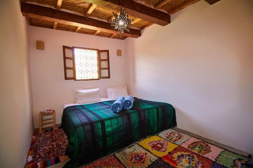 Ein Bett oder Betten in einem Zimmer der Unterkunft Gîte Imsker Elbour