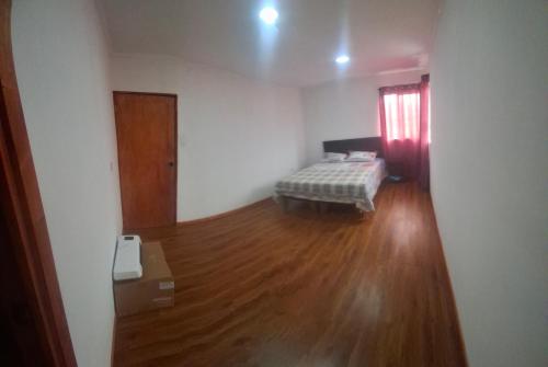Ένα ή περισσότερα κρεβάτια σε δωμάτιο στο Amplia Casa Familiar huaquen la ligua