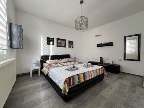 a bedroom with a large bed in a room at House Dea in Mostar