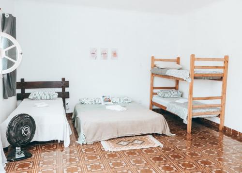Ένα ή περισσότερα κρεβάτια σε δωμάτιο στο Pousada Praia do Sonho