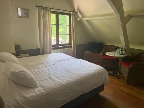 Postel nebo postele na pokoji v ubytování Hotel In't Boldershof