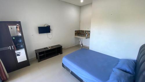Televisyen dan/atau pusat hiburan di Room in Pesanggaran