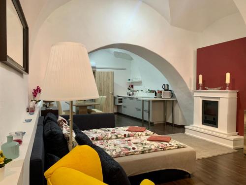 a person laying on a couch in a living room at Nuovo Casa in Sopron