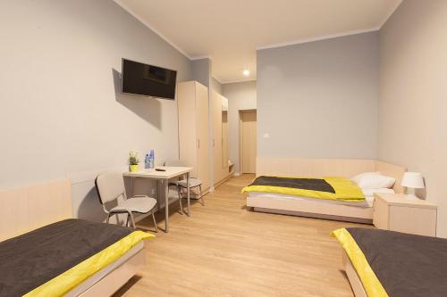 Ein Bett oder Betten in einem Zimmer der Unterkunft Inwest Ośrodek Szkoleniowo-Wypoczynkowy