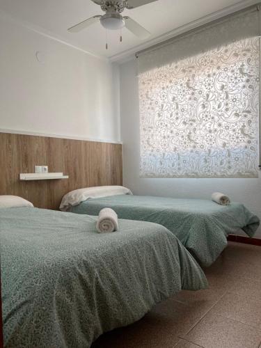 Posteľ alebo postele v izbe v ubytovaní Apartamento CA VALEN 2