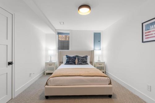 a bedroom with a bed and two night stands at Wayzata Cove in Wayzata